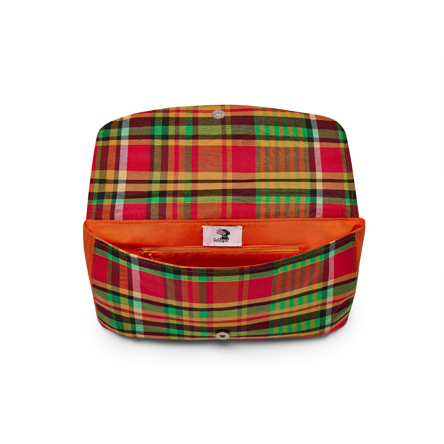Opened Mahalia clutch bag with a Antigua & Barbuda Madras print panel & orange lining, Papaya Orange textured leather cover, showing internal cable and zipped pocket against a white background.